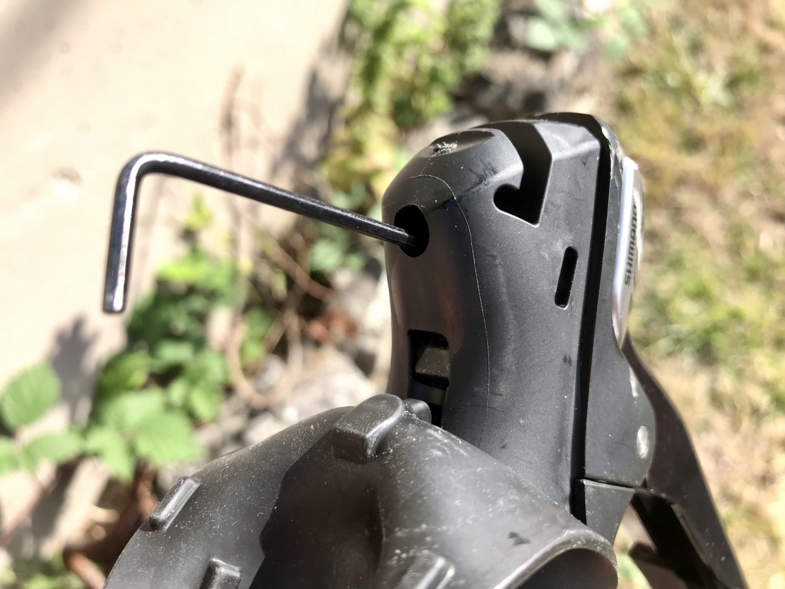 Shimano STI lever reach adjustment and fix for a loose screw bikedale